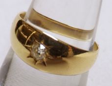 An early 20th Century Hallmarked 18ct Gold Ring set with a centre small Old Cut Diamond in gypsy