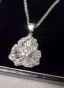 A white metal framed all White Sapphire set flower head design Pendant, 27mm drop, stamped “.925”,