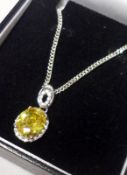 A white metal framed large Yellow Topaz Pendant with White Topaz surround and mounts to hanger, 22mm