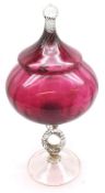 A large Cranberry and Clear Glass Covered Vase, raised on a split rope-twist design stem and a round