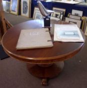 A William IV period Mahogany Circular Pedestal Dining Table, moulded edge over a plain frieze and
