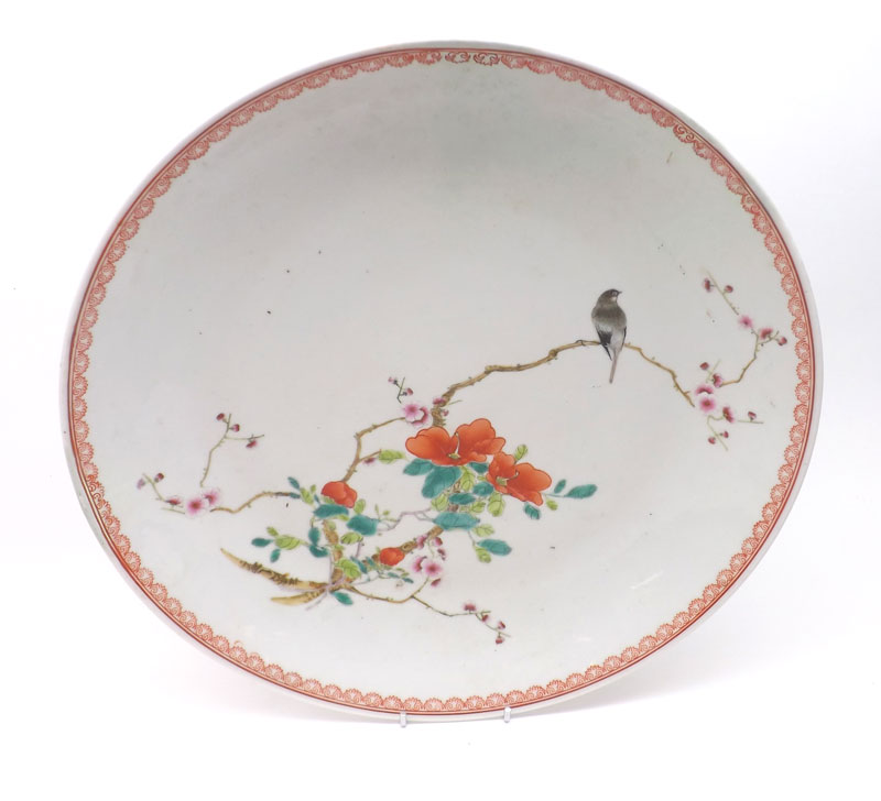 A Satsuma Circular Plate, painted in colours with a bird perched on a branch amidst floral sprig