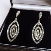 A pair of Art Deco style all White Sapphire set Articulated Drop Earrings, 33mm drop