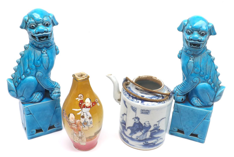 A pair of Oriental Blue Glaze Models of Temple Dogs seated on pedestals; a further Cylindrical