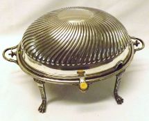 A 19th Century Oval Ham Stand, of typical form with pull over lid with fluted detail, raised on four