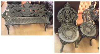 A pair of Cast Iron Garden Chairs, the ornate dome topped backs with pierced design to a round