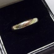 A hallmarked 9ct Tri-Colour Gold Wedding Ring, weighing approximately 3 ½ gm