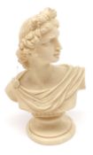 A Carved Ivorine Bust of Apollo, 4 ¼” high