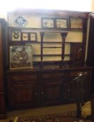 An 18th Century style Large Oak Dresser, the back with pierced frieze over three shelves and two