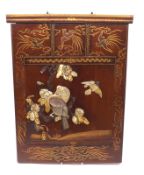 A 20th Century Oriental Hardwood Panel, decorated in the Shibayama manner with exotic birds and