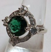 A white metal centre circular Green Tourmaline and White Sapphire Surround Cluster Ring, stamped “.