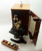 A 2nd quarter of the 20th Century Black Painted and Lacquered Brass Monocular Microscope, W R
