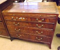 An early 19th Century Mahogany Chest with four graduated full length drawers, with brass swan neck