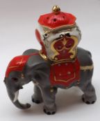 A Novelty China Table Lamp, modelled as an elephant decorated with reds and gold on a grey body,