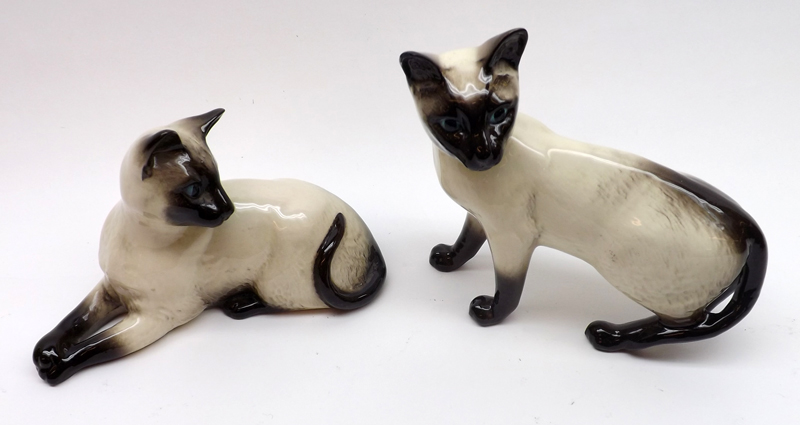 Two Beswick Model Siamese Cats, ones standing and one recumbent, the largest 6 ½” long