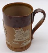 A Royal Doulton Stoneware Tankard, decorated with sprigs of hunting and tavern scenes, 5” high
