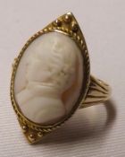 An Antique 15ct Gold Dress Ring featuring a carved stone Cameo of a gentleman’s head to a navette-