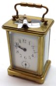 An early 20th Century lacquered French Brass Carriage Alarm Clock, the replacement platform