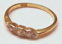 A high grade yellow metal three small Old Cut Diamond Ring, stamped “18ct”