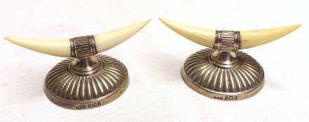 A pair of George V Ivory and Silver mounted Knife Rests on spreading circular bases, Sheffield 1910,