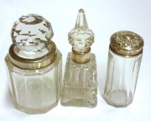 Three various assorted Clear Glass Dressing Table Bottles with hallmarked collars/lid, various dates