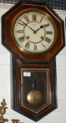 An early 20th Century Wall Clock, the octagonal surround with black painted and gilt highlighted