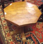 A Mouseman Octagonal Pedestal Table in light oak, the octagonal top raised on a platform support