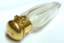An unusual small Tapering Scent Bottle, the 18ct Gold hinged lid fitted with a small ground glass