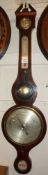 A 19th Century Mahogany Wheel Barometer, with replacement broken arch pediment and central urn