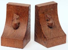 A pair of Mouseman Bookends, of plain angled upright form, each typically carved with mouse motif,