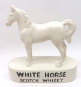 A White Horse Scotch Whiskey Bar Advertising Figure, black lettering on a white background, 8” long
