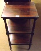 A small early Victorian Rosewood Three Tier Stand or Whatnot, raised on turned legs with brass
