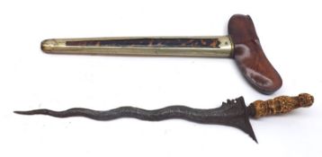 An unusual Eastern Dagger with carved handle, metal and tortoiseshell mounted scabbard, 17” wide