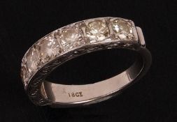 A high grade precious metal Half Hoop Ring set with seven Brilliant Cut Diamonds, estimated total