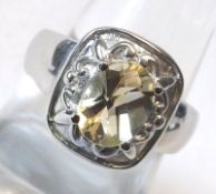 A hallmarked Sterling Silver Solitaire Ring set with Citrine stone of approx .950 ct