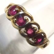 A hallmarked 9ct Gold Ring set with a group of four red stones