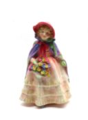 A small Royal Doulton Figurine, “Granny’s Shawl”, HN1642, (slight hairline to base), 5 ½” high