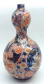 A Japanese Imari Baluster Vase of double gourd form, typically painted in traditional colours with