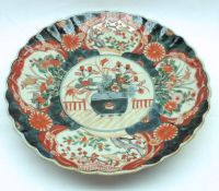 A 19th Century Imari Circular Dish with a crimped rim, typically decorated in traditional colours,