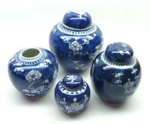 A collection of four Oriental Covered Ginger Jars all decorated in underglaze blue with a prunus