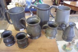 A collection of nine various 19th Century and later Pewter Tankards and Measures, various sizes