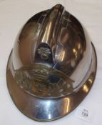 French Chromed and Brass Fire Helmet with badge, “Sapeurs Pompiers Rochechouart”, leather chip strap
