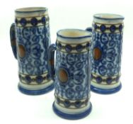 A graduated set of three late 19th/early 20th Century German Jugs decorated with blue geometric