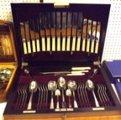 An early 20th Century Walnut Cased Canteen of Cardinal Plate Cutlery, supplied by James Walker
