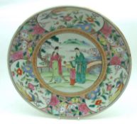 A 20th Century Oriental Circular Plate, the centre decorated in colours with scene of figures in a