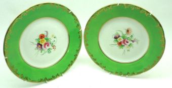 A pair of 19th Century Dessert Plates, decorated with central floral sprays to a green and gilt