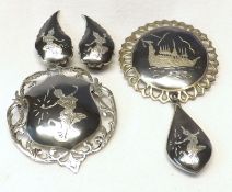 A Sterling Silver (Made in Siam) Suite of two Brooches (one with hanging pendant) and a pair of