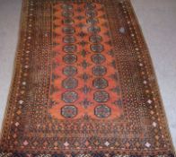 A Caucasian Carpet with multi gull border, central panel of lozenges and cruciform designs, mainly