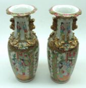 Two Canton Famille Rose Baluster Vases, the necks moulded with temple dogs and also decorated