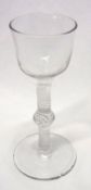 An 18th Century Liqueur Glass with clear glass bowl to a knopped stem with extensive white air twist